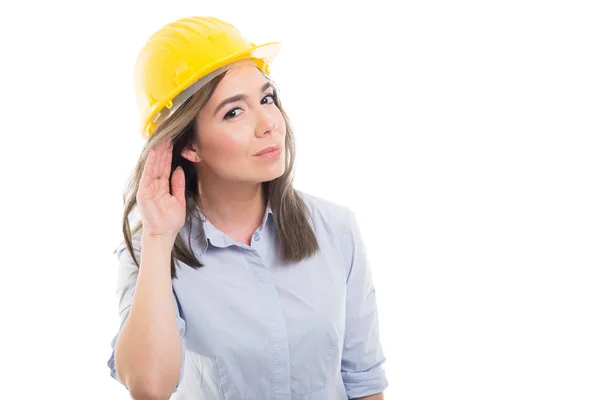Portrait of female constructor showing can\'t hear yo