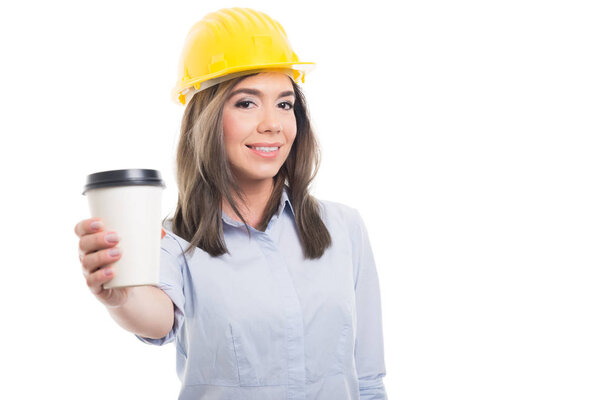 Pretty female constructor offering takeaway coffe