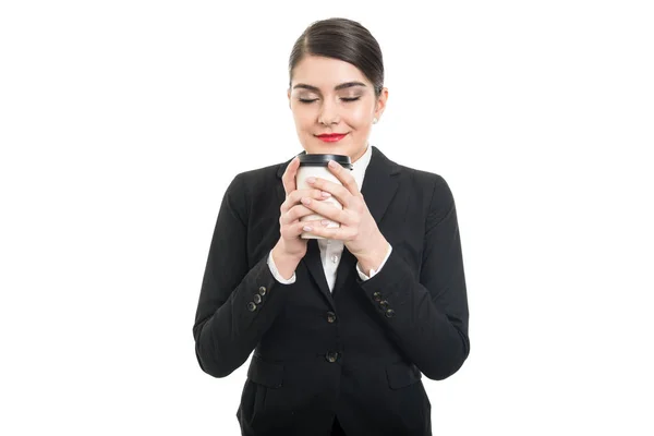 Portrait of beautiful stewardess smelling takeaway coffee cup — Stock Photo, Image