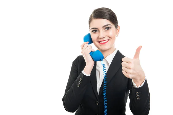 Beautiful stewardess talking at big blue receiver showing like — Stock Photo, Image