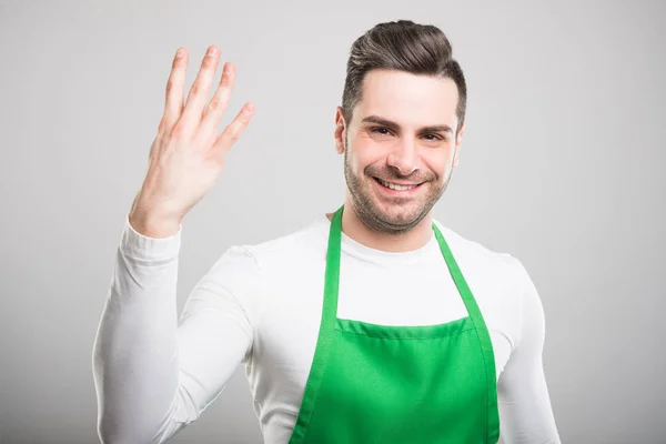 Atractivo empleador de supermercado mostrando número fou — Foto de Stock