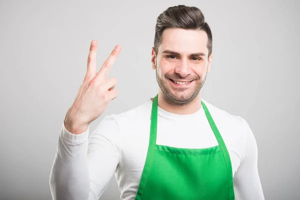 Goed uitziende supermarkt werkgever tonen nummer tw — Stockfoto