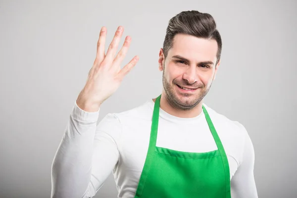 Goed uitziende supermarkt werkgever tonen nummer fou — Stockfoto