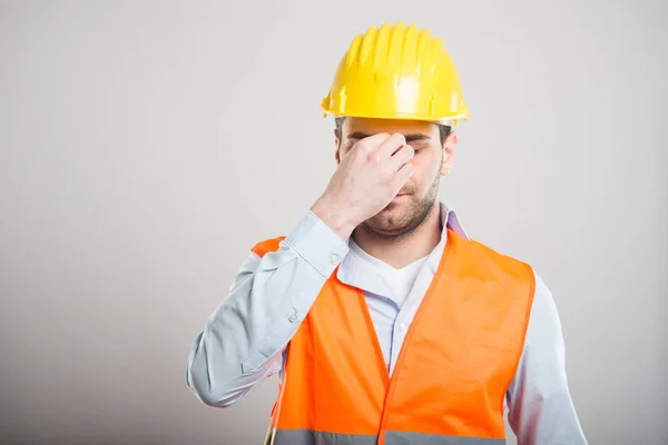 Portrait of attractive architect making tired gesture — Stock Photo, Image