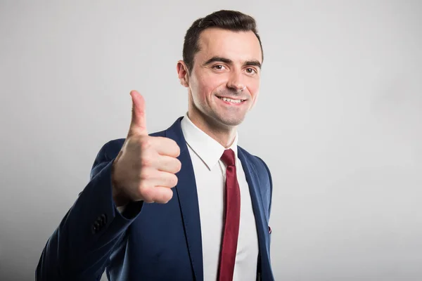 Portrait of young attractive business man showing like gesture — Stock Photo, Image