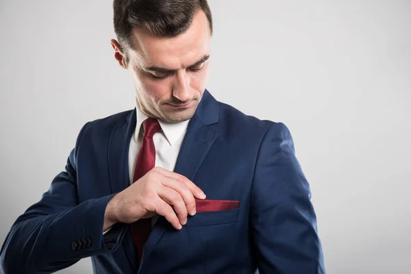 Portrait of business man wearing suit arranging jacket pocket — Stock Photo, Image