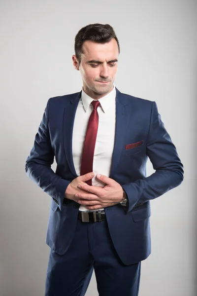 Attractive business man holding belly like hurting — Stock Photo, Image