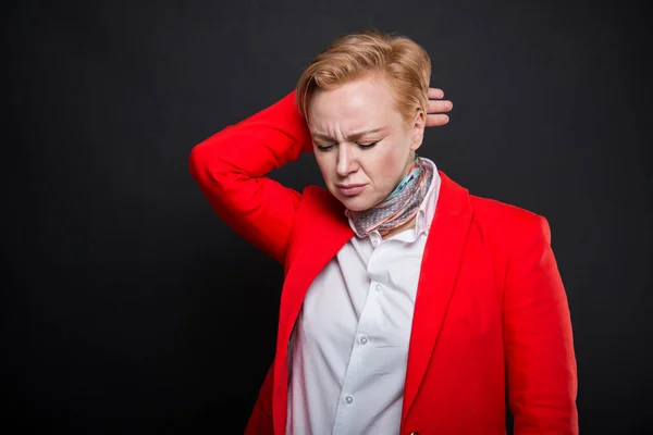 Portrait of attractive business woman holding back neck like hur — Stock Photo, Image