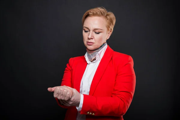 Portrait of attractive business woman holding wrist like hurting — Stock Photo, Image