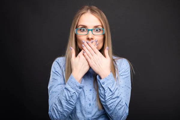 Business lady wearing blue glasses covering mouth like mute gest — Stock Photo, Image