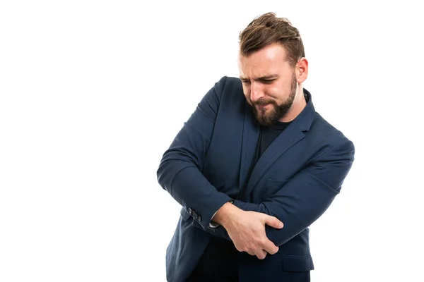 Homem Negócios Vestindo Roupas Casuais Inteligentes Gesticulando Dor Cotovelo Isolado — Fotografia de Stock