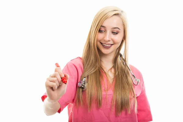 Portrait Female Doctor Wearing Scrubs Writing Red Marker Isolated White — Stock Photo, Image