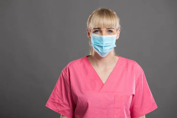 Portrait Young Attractive Female Nurse Wearing Face Mask Gray Background — Stock Photo, Image