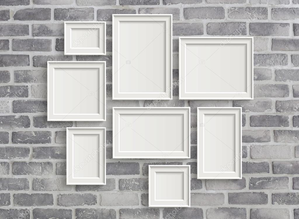blank frames on grey birck wall