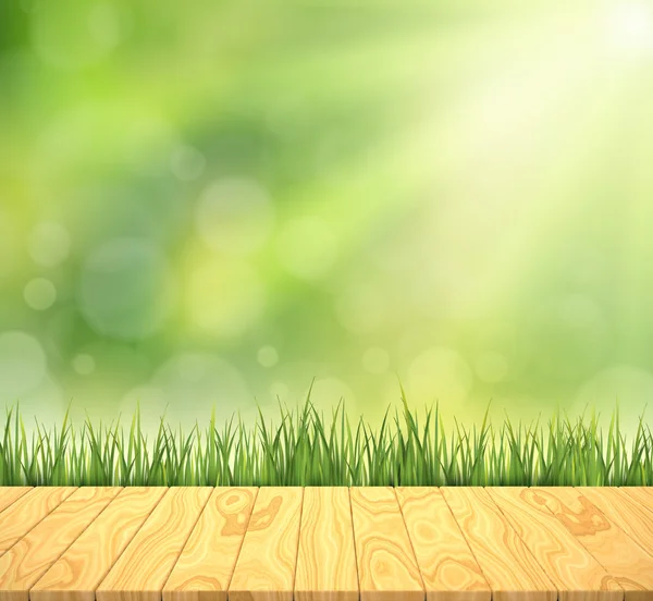 Zelený trávník s dřevěnými obilí — Stock fotografie