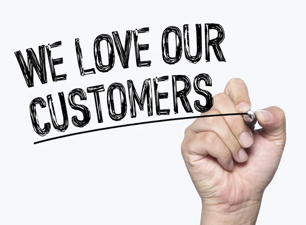 We love customers written by hand — Stock Photo, Image