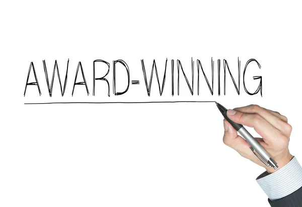 Przyznawać zwycięski napisany ręcznie — Zdjęcie stockowe