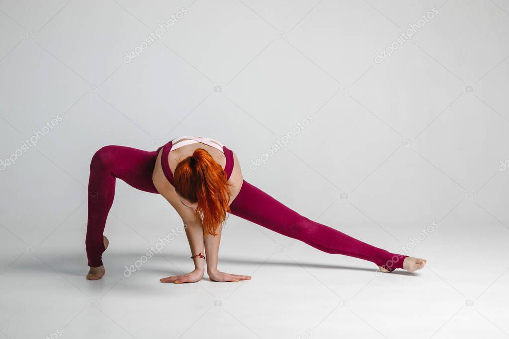 attractive girl doing yoga exercises