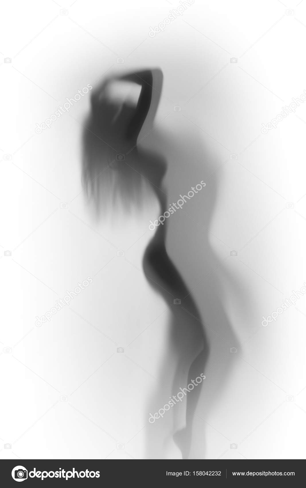 Sexy erotic womens body behind blurry glass
