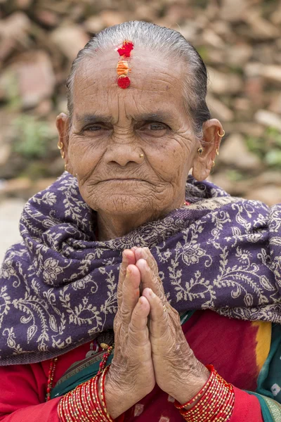 Portrait old woman in traditional dress with folded hands in street Kathmandu, Nepal — Stock Photo, Image