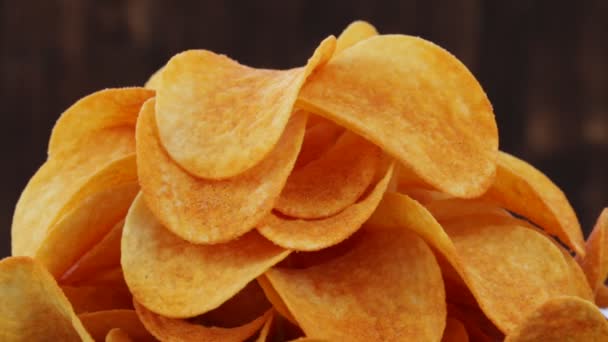 Rotating potato chips closeup, macro view food background — Stock Video