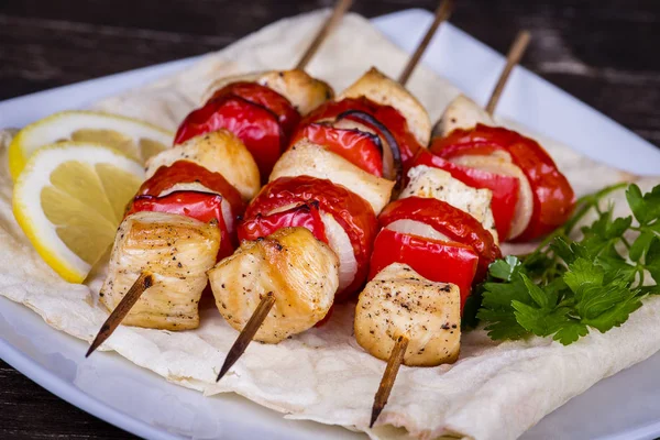 Tasty grilled meat and vegetables on skewer — Stock Photo, Image