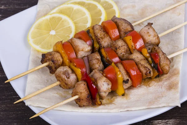Tasty grilled meat and vegetables on skewer — Stock Photo, Image