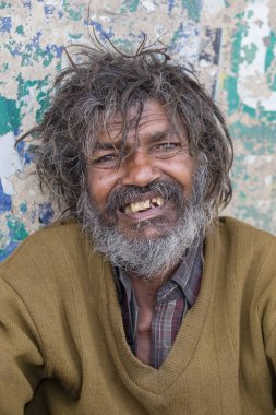 Portrait homeless person in Varanasi, India clipart