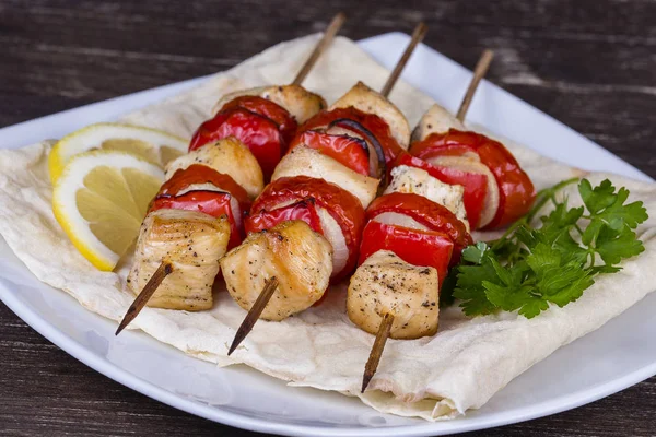 Tasty grilled meat and vegetables on skewer — Stock Photo, Image