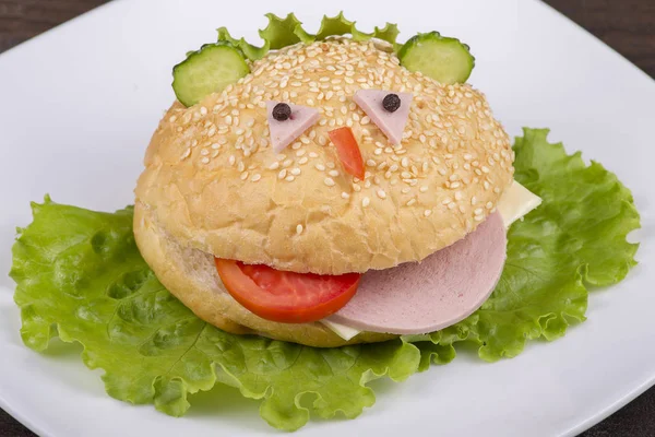 Fun food for kids - hamburger looks like a funny muzzle — Stock Photo, Image
