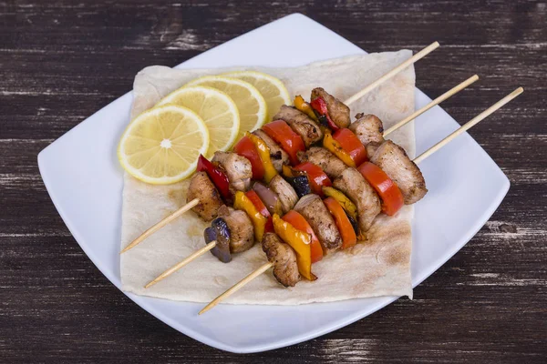 Tasty grilled meat and vegetables on skewer — Stock Photo, Image