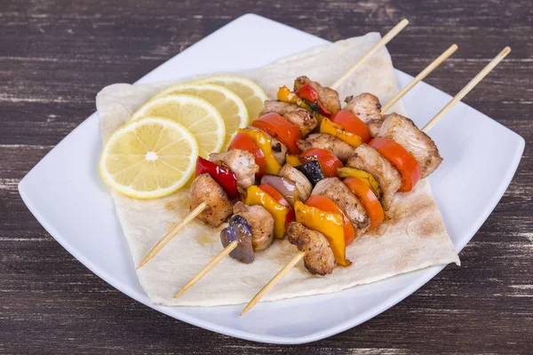 Tasty grilled meat and vegetables on skewer — Stock Photo, Image