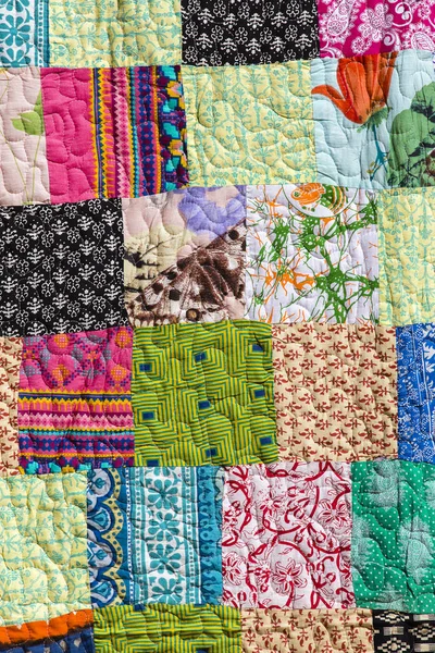 Colorful patchwork blanket, close up — Stock Photo, Image