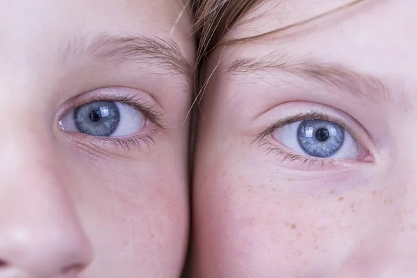 Close up two young girl eyes, couple portrait children, macro, indoors — Stock Photo, Image