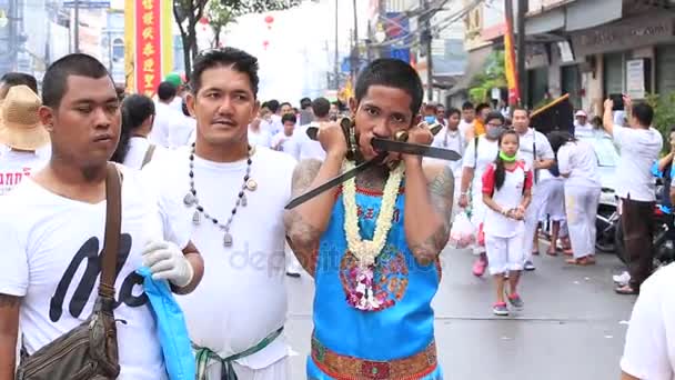 Chinese thai monk possessed by his god walks with his mouth pierced in Vegetarian Festival at Phuket, Thailand — Stock Video