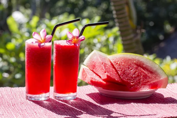 Two healthy watermelon smoothie and slice of watermelon. In the morning, close up — Stock Photo, Image