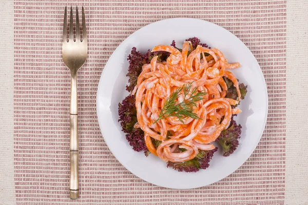 Fresh salad from raw carrots with sour cream. Top view, close up — Stock Photo, Image