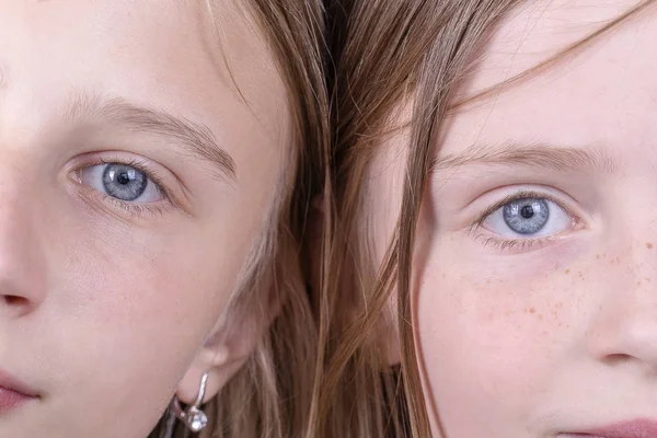 Close up two young girl eyes, they are looking at the camera, couple portrait children, macro — Stock Photo, Image