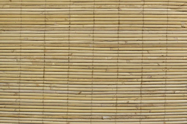 Tapete de palha marrom de bambu como composição de fundo de textura abstrata — Fotografia de Stock