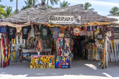 Front view of African shop clothes and souvenirs for tourists on the beach in Zanzibar island, Tanzania, east Africa clipart