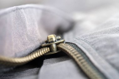 Fermuarlı pantolon, makro desenli arka plan, kapat.