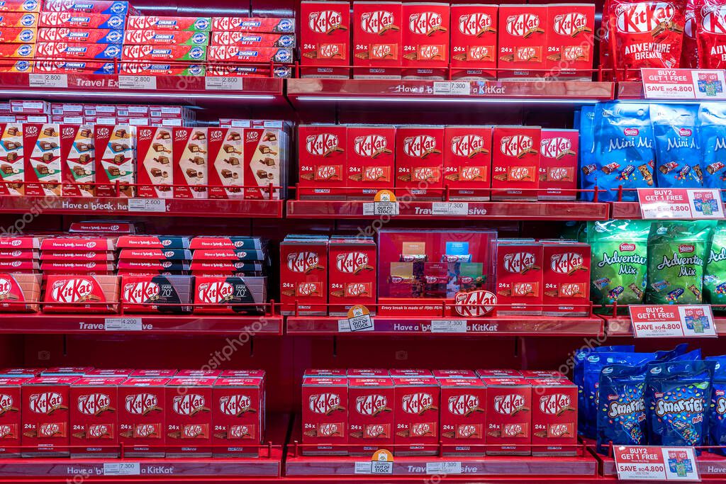Muscat, Oman - january 19, 2020 : Kit Kat chocolates and other sweets on a shelf at the duty-free shop at the Muscat international airport, Oman