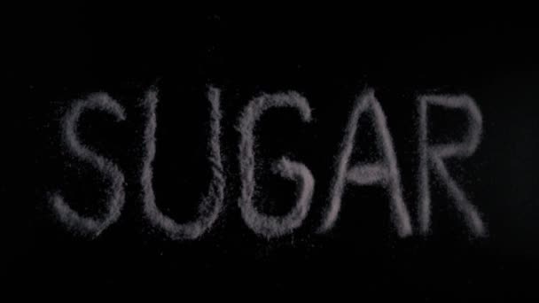 写在黑色的背景上的慢动作词糖 — 图库视频影像