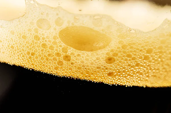 Beer with foam in a glass close-up — Stock Photo, Image