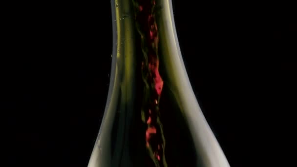 Slow motion. Pour red wine into the bottle — Stock Video