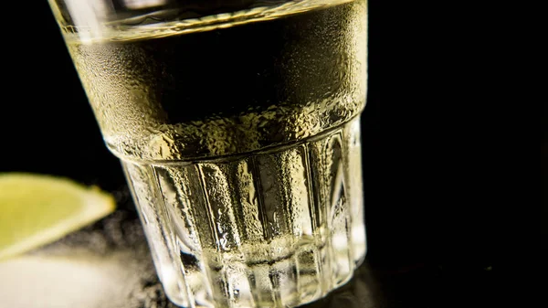 A glass of foggy tequila, a point of view at an angle — Stock Photo, Image