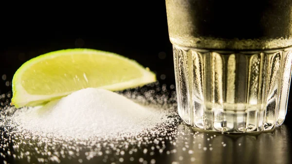 The bottom of a tequila with salt and lime — Stock Photo, Image