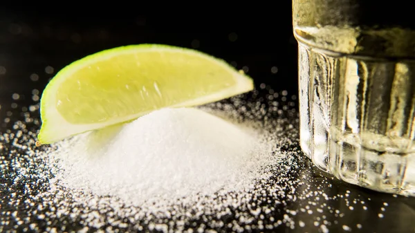 A pile of salt with lime and tequila — Stock Photo, Image