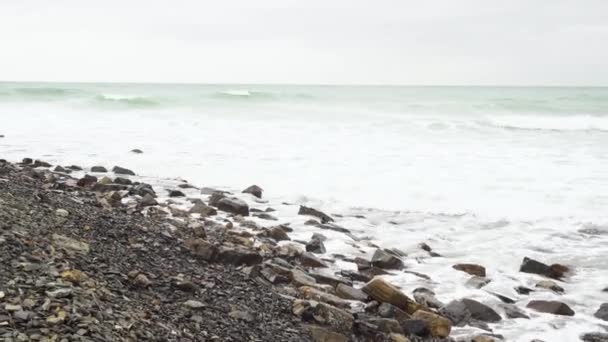 Movement of the camera along the stony shore of the sea — Stock Video