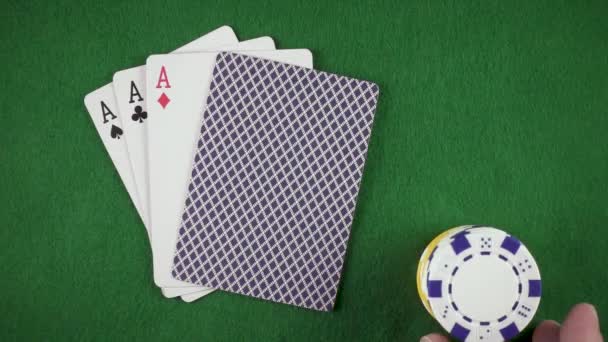 Slow motion hand puts chips on the table top view — Stock Video